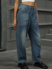 Relaxed fit medium wash denim trousers with patchwork detail and wide leg.