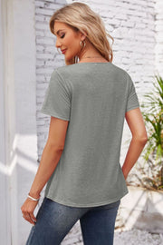 Gray short sleeve casual top with button detail at the yoke.