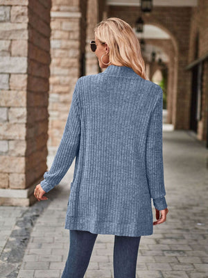 Light blue ribbed open-front cardigan with pockets and a relaxed fit.