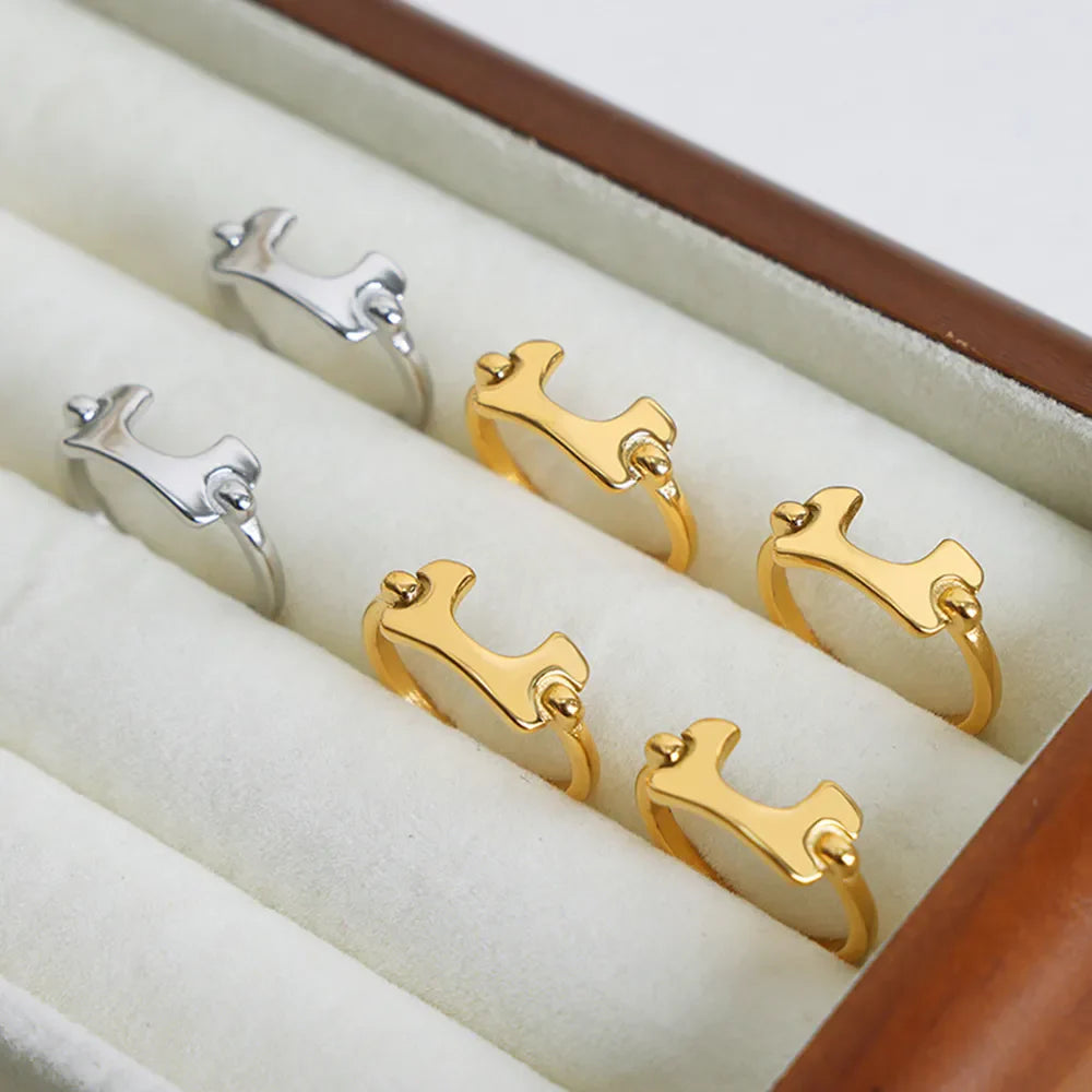 Sculptural gold and silver open-ended rings with unique asymmetrical design.