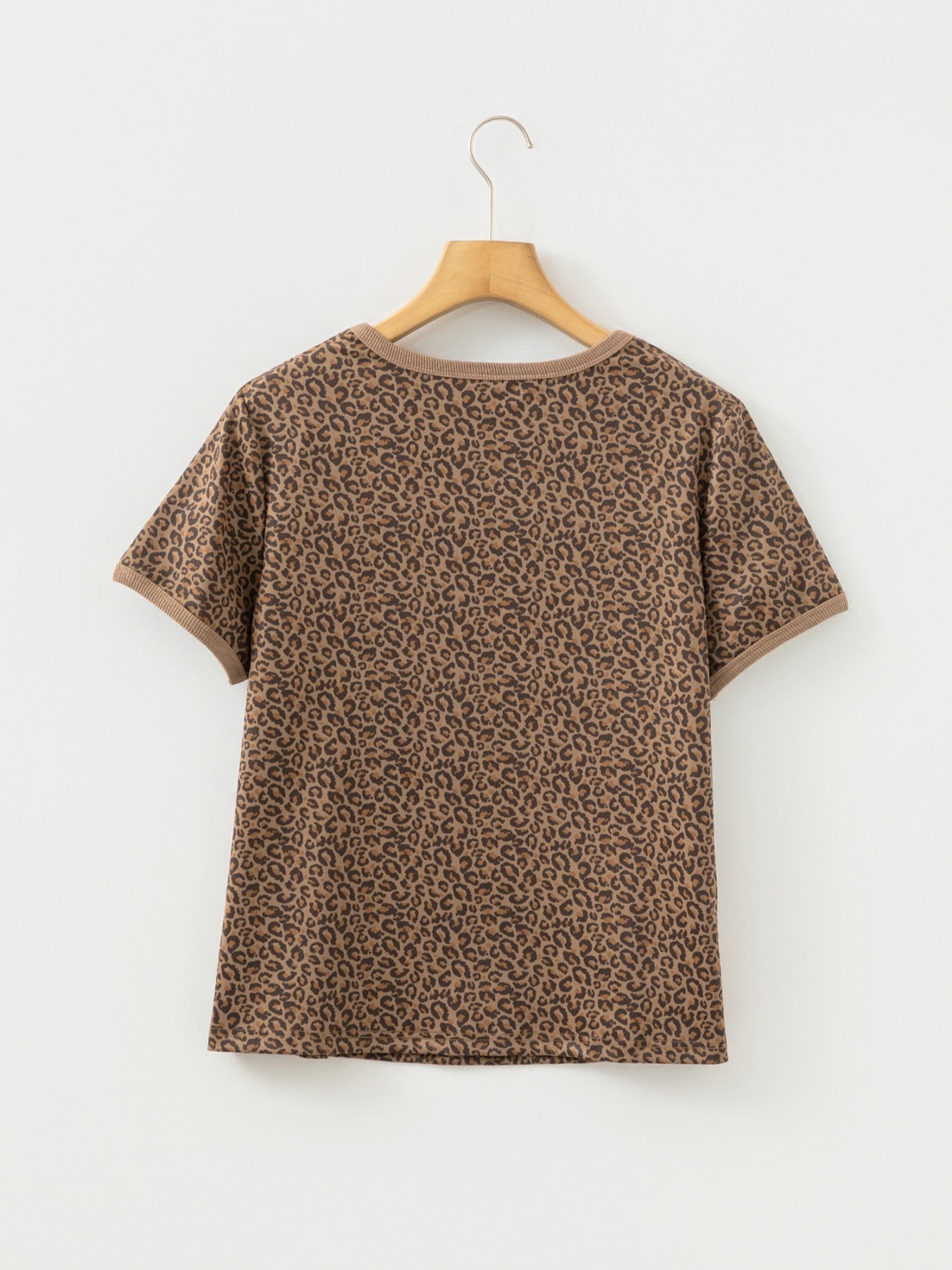 Brown leopard print t-shirt with crew neck and short sleeves.