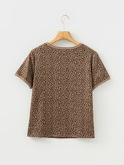 Brown leopard print t-shirt with crew neck and short sleeves.