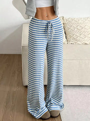 Light blue ribbed wide-leg pants with white stripes and a drawstring waist.