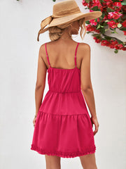 Hot Pink camisole mini dress with tiered ruffled skirt and spaghetti straps.