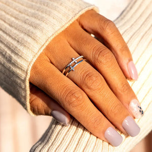Double cross diamond band ring in silver with two stacked bands and cross details.