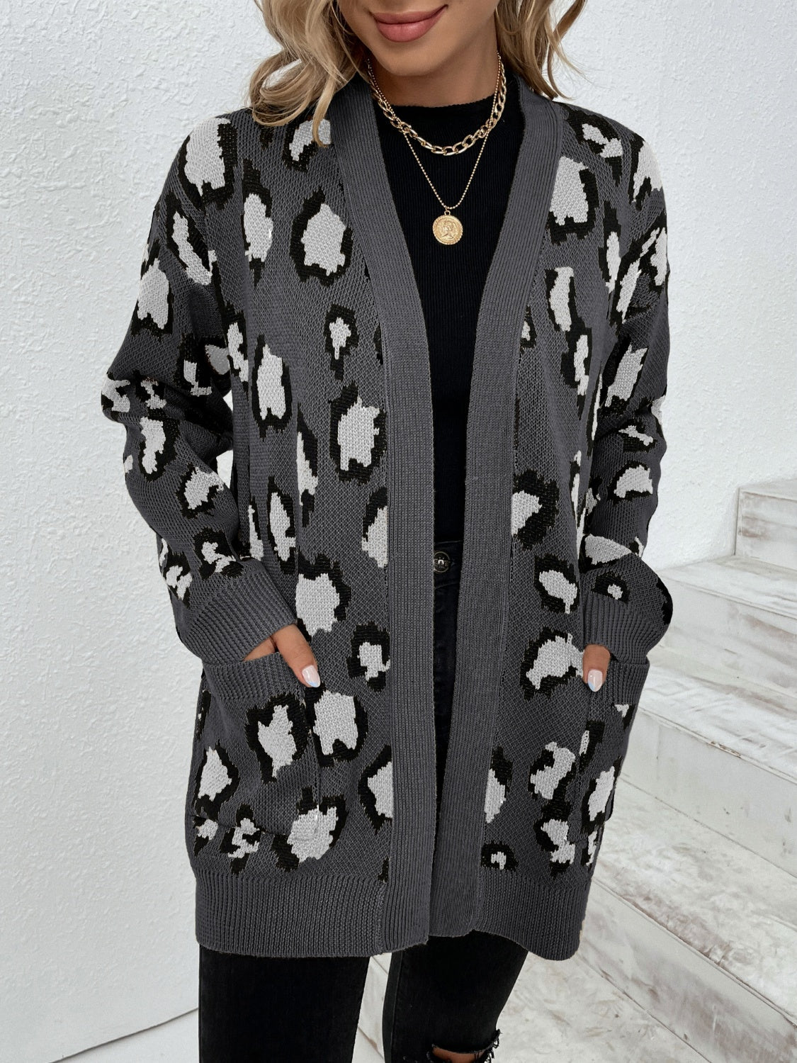 Dark gray leopard print open-front knit cardigan with pockets.
