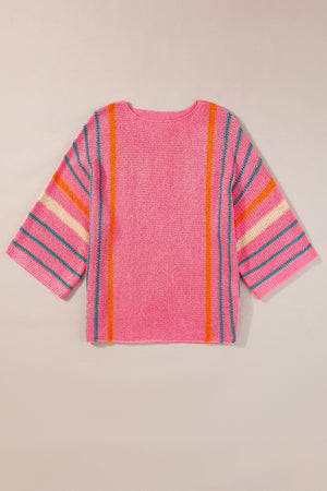 Pink knit pullover sweater with colorblock stripes on sleeves and vertical stripes.