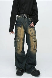 Faded wash dark denim oversized cargo jeans with multiple button flap pockets.