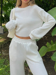 White waffle knit cropped lounge set with crew neck and long sleeves.