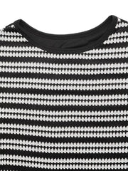 Black and white striped knit maxi dress with crew neck detail.