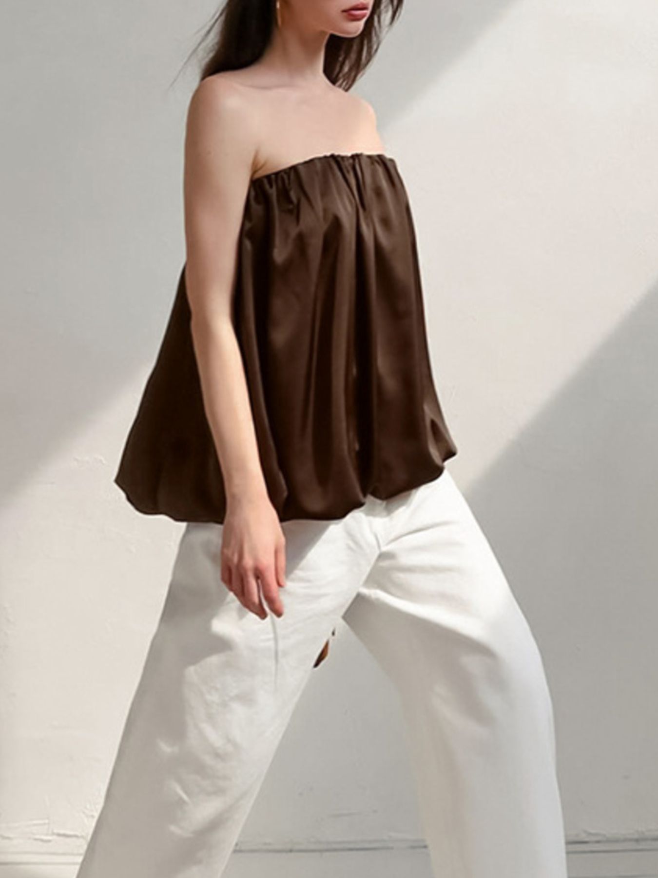Dark brown strapless bubble hem top with a gathered neckline.