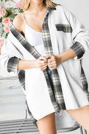 Waffle knit overshirt in white with black plaid trim and button front.
