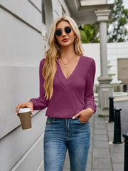 Plunge neckline gathered sleeve top in deep purple, casual long sleeve blouse with V-neck detail.
