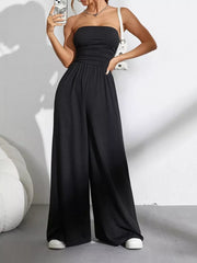 Black strapless tube top wide-leg romper with ruched waist detail.