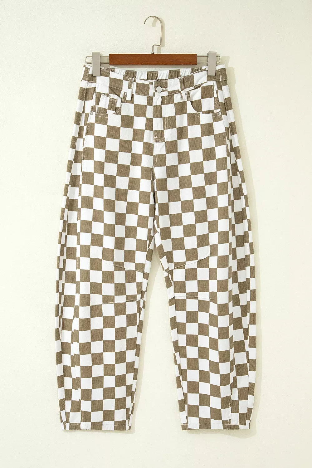 Chic checkered denim barrel pants in brown and white cotton, featuring a relaxed fit and knee patch details.