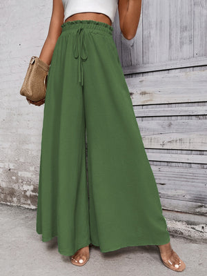 Light green ruffled waistline palazzo trousers with drawstring and wide legs.