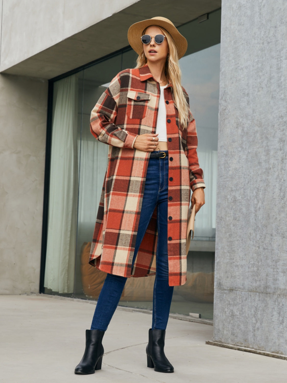 Oversized plaid shirt jacket dress in orange-red, cream, and brown with button front and chest pockets.