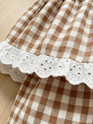Gingham baby set with white eyelet ruffle trim.