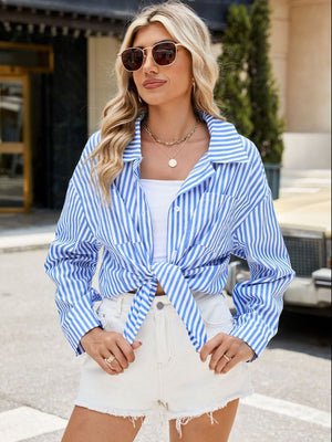 Sky blue striped oversized shirt with tie-front detail and button closure.