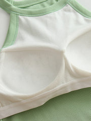 Ribbed halter crop top in Gum Leaf green with white lining and contrast stitching detail.