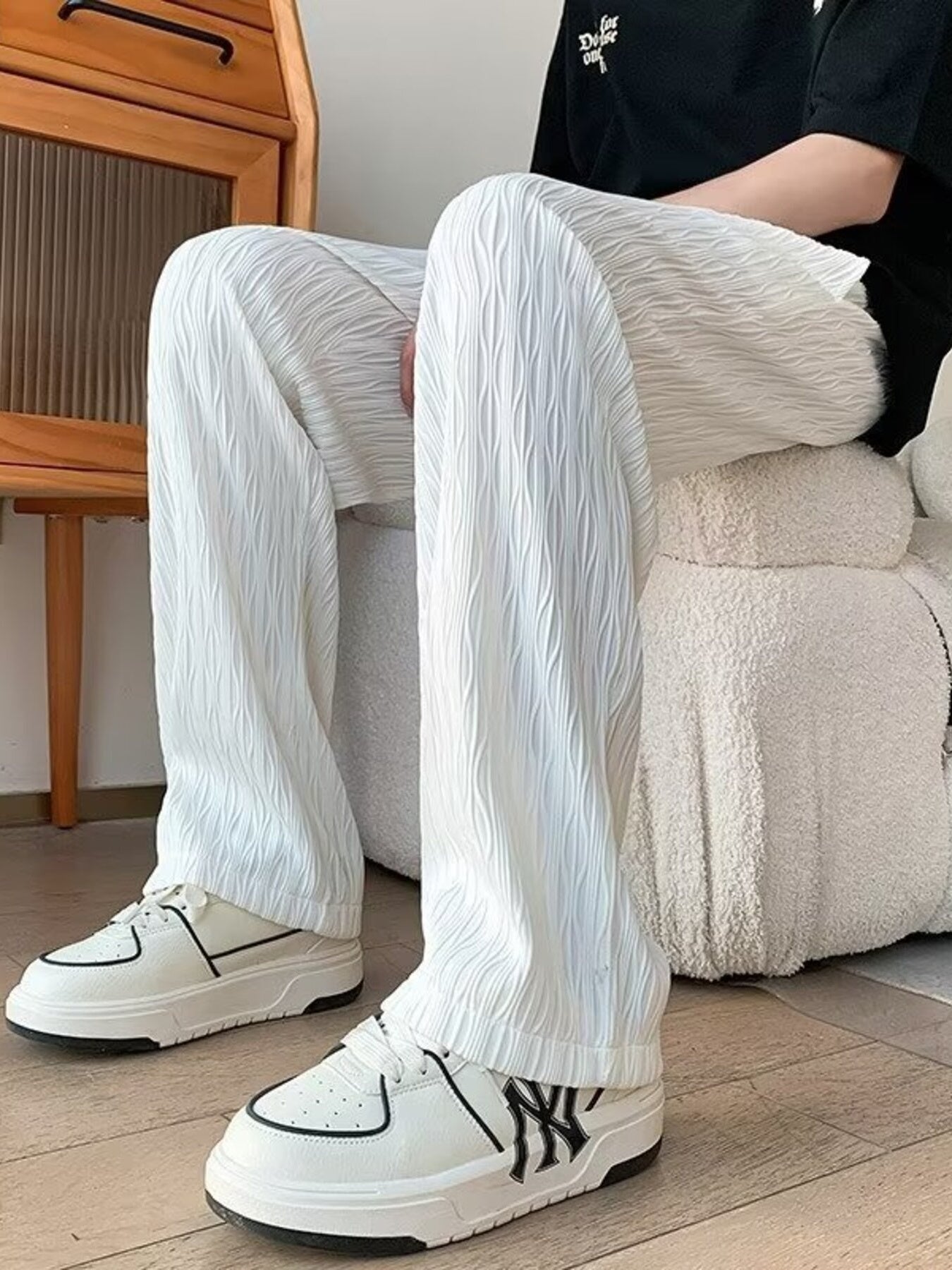 White textured wide-leg drawstring sweatpants with a relaxed fit.