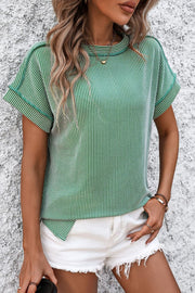 Green vertical ribbed tee with split hem and short sleeves.
