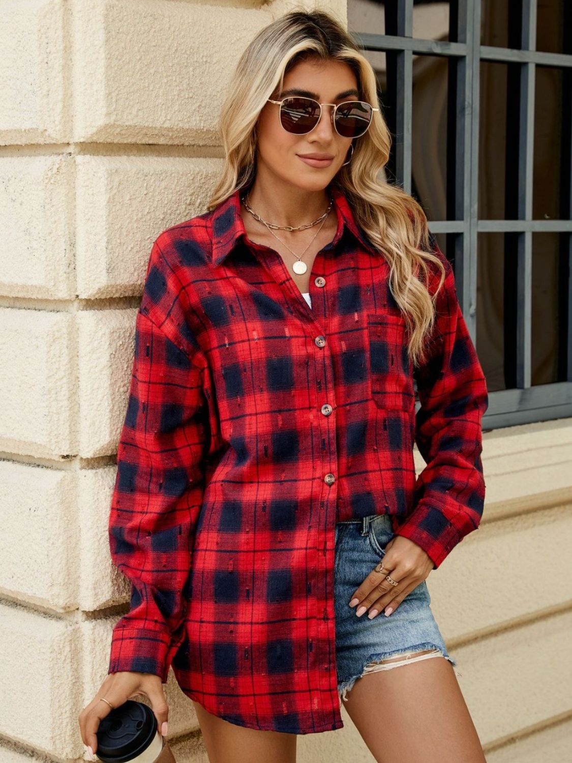 Distressed plaid overshirt in deep red and black with a relaxed fit and button front.