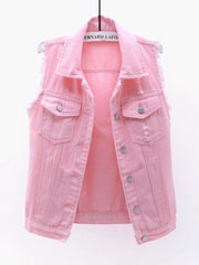 Pink denim vest with frayed shoulders and distressed details