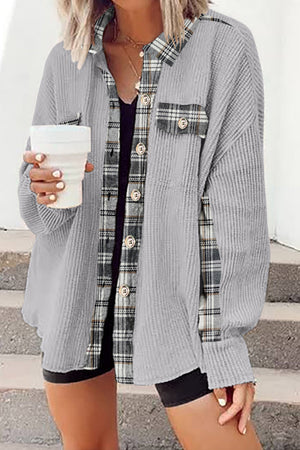 Light Gray waffle knit overshirt with plaid trim and button front, worn open over a black tank top.
