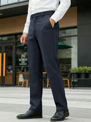 Men's navy classic fit dress pants with pockets, styled with a white dress shirt.