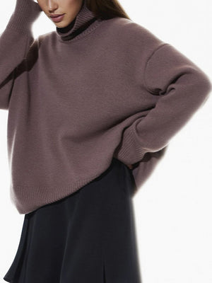 Relaxed turtleneck sweater in mocha with sculptural sleeves and ribbed cuffs.