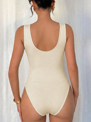 Cream cowl neck sleeveless bodysuit with high-cut leg