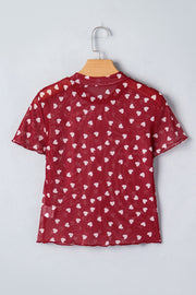 Deep red sheer mesh t-shirt with white heart print, short sleeves, and lettuce hem.