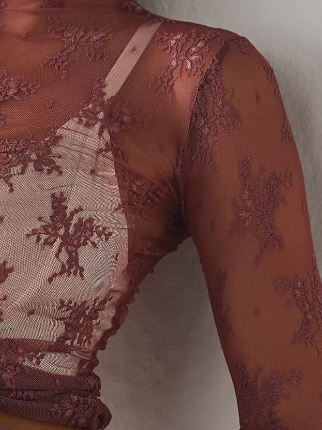 Burgundy floral lace illusion mock neck long sleeve blouse with sheer sleeves.