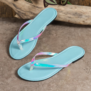 Sky blue toe-post sandals with iridescent straps.