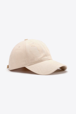 Cream distressed baseball cap with adjustable strap