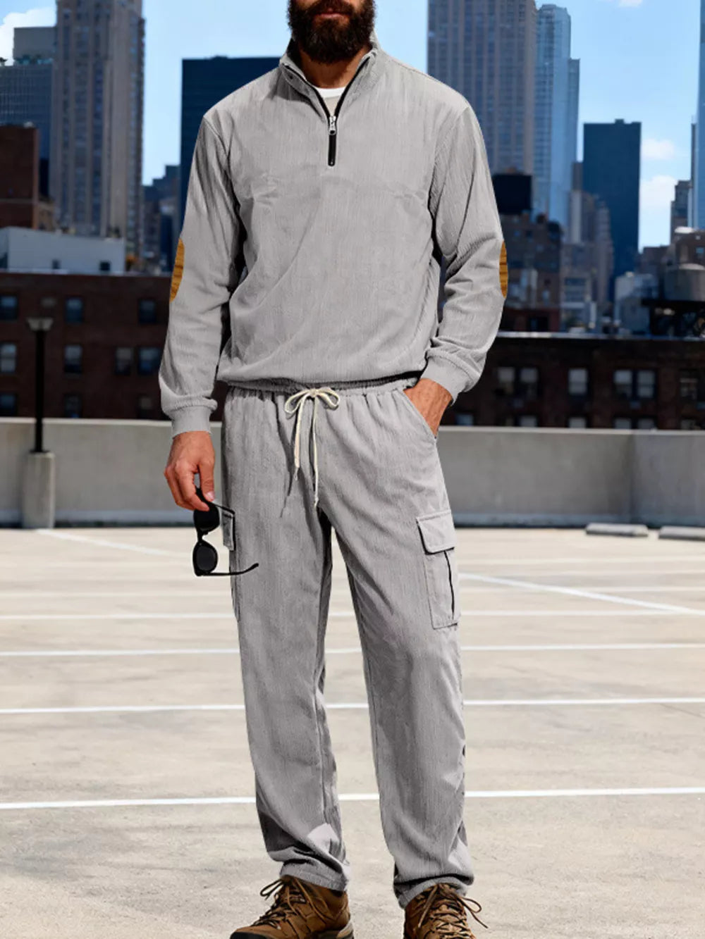Men's gray two-piece set with quarter-zip pullover and cargo pants, featuring elbow patches.
