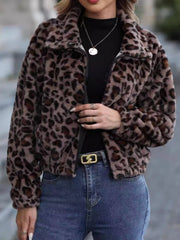 Leopard print faux fur zip-up jacket with a collar and long sleeves.