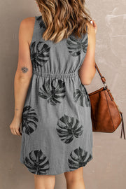 Botanical print sundress in charcoal with elastic waist and A-line skirt.