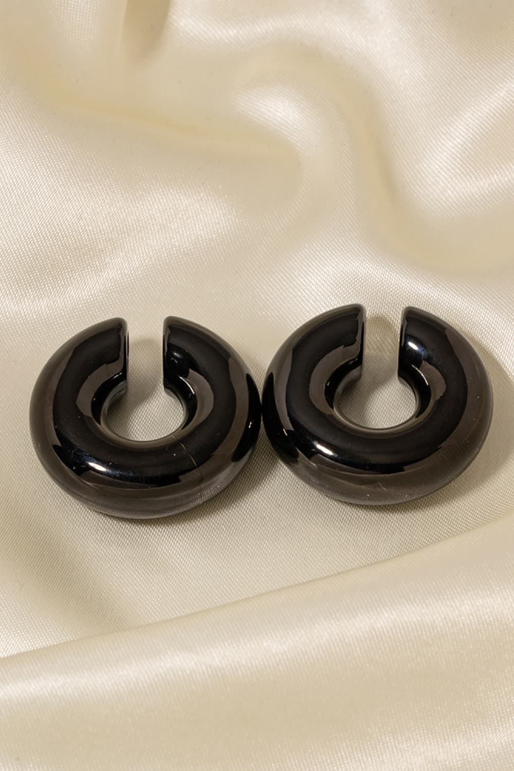 Glossy black crescent cuff earrings with 18K gold-plated finish