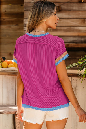 Ribbed tee in cerise with colorblock trim on neckline, sleeves, and hem.