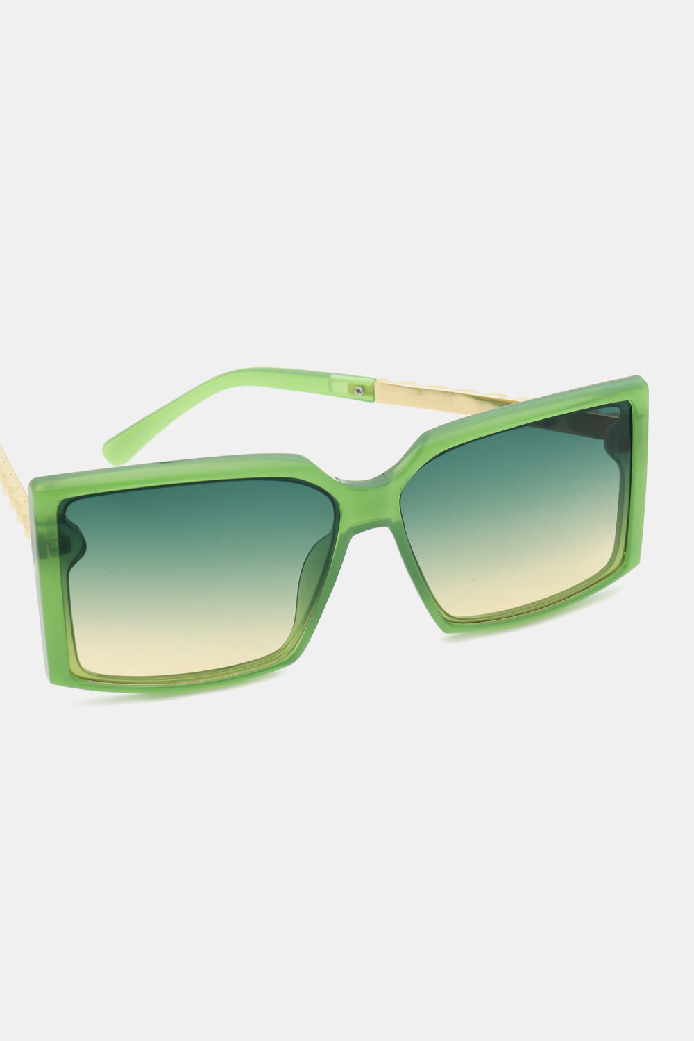 Green geometric sunglasses with gradient lenses and gold accents.