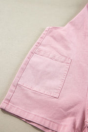 Blush pink denim short overalls with a front pocket detail.