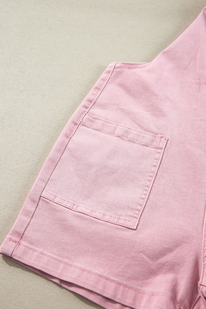 Blush pink denim short overalls with a front pocket detail.