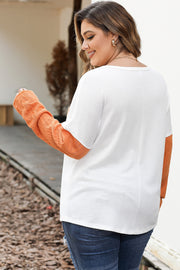 Colorblock knit pocket tee in white with orange sleeves, crew neck, and textured knit detail.