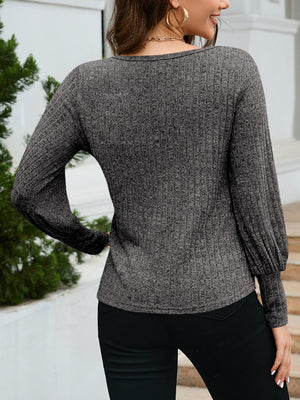 Charcoal scoop neck knit sweater with balloon sleeves and ribbed texture.