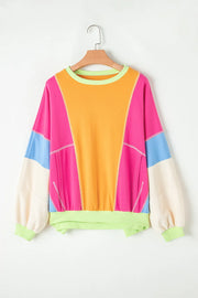 Colorblock paneled sweatshirt with neon trim, crew neck, long sleeves, and pockets.