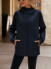 Navy zip-through hooded jacket with pockets and elastic cuffs.