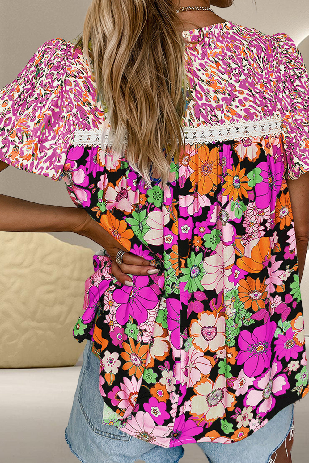 Floral patchwork puff sleeve blouse with lace trim and bright floral print.