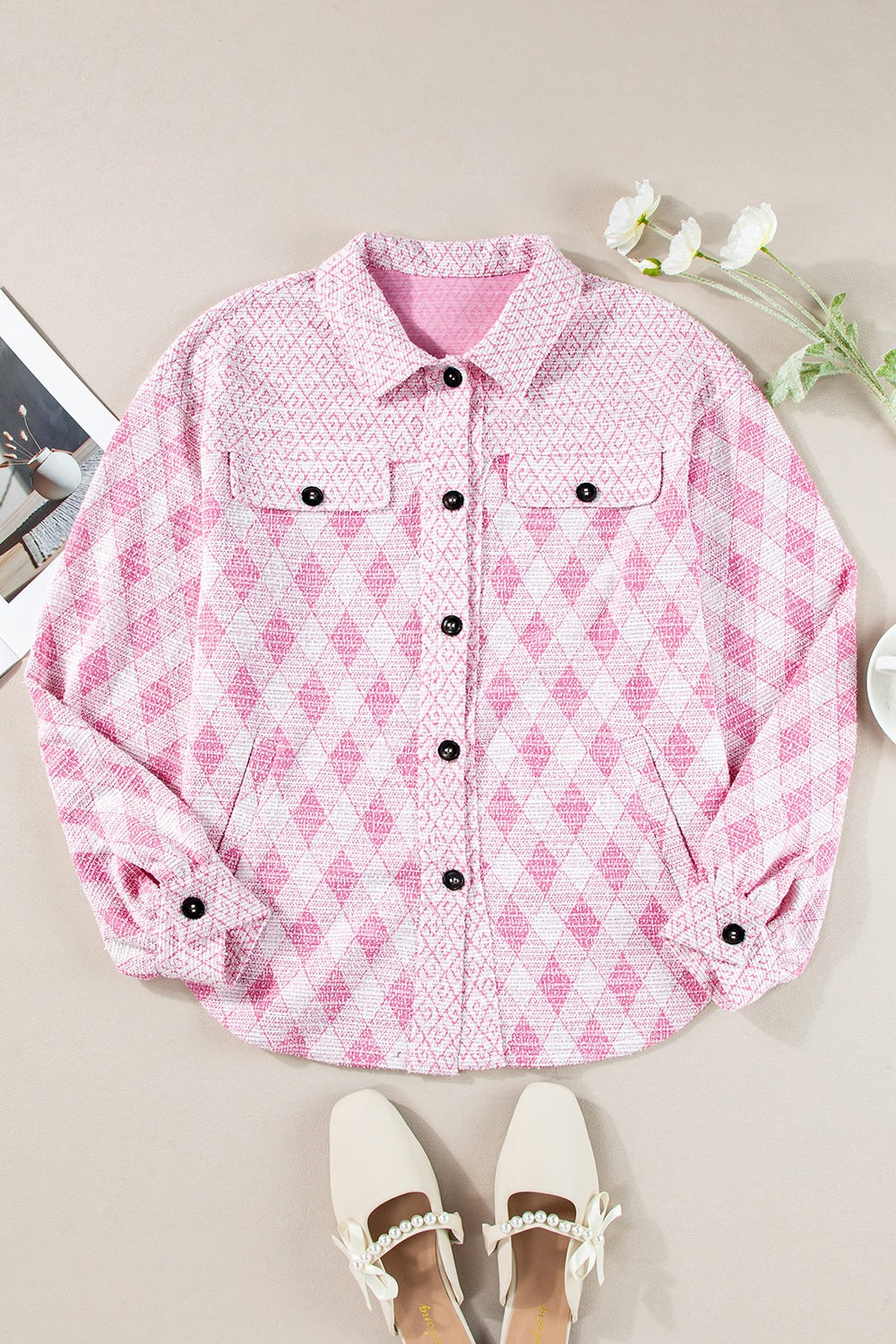 Pink diamond weave shacket with puff sleeves and buttoned front.